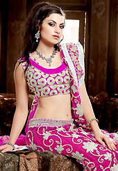Elegance and innovation of designs crafted for you. This magenta net lehenga choli is nicely embroidered patch work is done with zari, gota patti and lace work. All over embroidery work on lehenga is stunning. The beautiful heavy embroidery on lehenga made it awesome and gives you stylish and attractive look to others. Matching choli and dupatta is availble with this lehenga. Accessories shown in the image is just for photography purpose. Slight Color variations are possible due to differing screen and photograph resolutions.