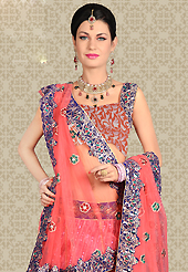 No one like ordinary look, because every woman has their own beauty and our collection gives extra ordinary look to you. This pink net a-line lehenga is nicely embroidered patch work is done with resham, zari, sequins and stone work. The beautiful embroidery on lehenga made it awesome and gives you stylish and attractive look to others. Matching choli and dupatta is availble with this lehenga. Slight Color variations are possible due to differing screen and photograph resolutions.