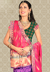 Make your collection more attractive and charming with this impressive dress. This purple net a-line lehenga is nicely embroidered patch work is done with resham, zari, stone and lace work. The beautiful embroidery on lehenga made it awesome and gives you stylish and attractive look to others. Contrasting green choli and pink net dupatta is availble with this lehenga. Slight Color variations are possible due to differing screen and photograph resolutions.