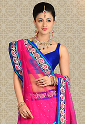 The evolution of style species collection spells pure femininity. This dark pink net a-line lehenga is nicely embroidered patch work is done with resham, zari and stone work. The beautiful embroidery on lehenga made it awesome and gives you stylish and attractive look to others. Contrasting royal blue choli and pink net dupatta is availble with this lehenga. Slight Color variations are possible due to differing screen and photograph resolutions.