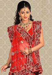 Elegance and innovation of designs crafted for you. This red net a-line lehenga is nicely embroidered patch work is done with zari, stone and cutbeads work. The beautiful embroidery on lehenga made it awesome and gives you stylish and attractive look to others. Matching choli and dupatta is availble with this lehenga. Slight Color variations are possible due to differing screen and photograph resolutions.