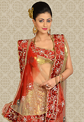 An occasion wear perfect is ready to rock you. This gold and maroon net a-line lehenga is nicely embroidered and velvet patch work is done with zari, stone and cutbeads work. The beautiful embroidery on lehenga made it awesome and gives you stylish and attractive look to others. Matching choli and dupatta is availble with this lehenga. Slight Color variations are possible due to differing screen and photograph resolutions.