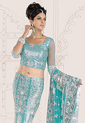 Make your collection more attractive  charming with this dazzling dress. A Lehenga made with shimmer net fabric. This lehenga embellished with stone, sitara work, and beads. A beautiful embroiderey made it stylish and fabulous, gives you a stunning look. Slight Color variations possible due to differing screen and photograph resolutions.