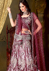 Today’s fashion is really about sensuality which can be seen in this creation. Embellish yourself with the classy dress. A Lehenga made with net. This drape is nicely designed with stone, sitara, and zari work heavy border. Amazing floral pattern work made it awesome and gives you elegant and gorgeous look to others. The matching blouse and chunari are enhanced your personality. Slight Color variations are possible due to differing screen and photograph resolutions.