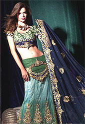 Today’s fashion is really about sensuality which can be seen in this creation. Embellish yourself with the classy dress.  A Lehenga made with net material with brocade inner. This drape is nicely designed with stone, sitara, and zari work heavy border patch. Embroidered silk blouse and georgette dupatta made it awesome and gives you elegant and gorgeous look to others. This bridal lehenga is enhanced your personality. Slight Color variations are possible due to differing screen and photograph resolutions.