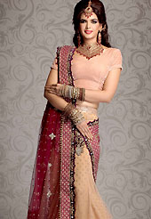 Desires that evokes a sense of belonging with a striking details. A beautiful A-line lehenga made with net fabric. This lehenga embellished with zardozi, crystal stone, salma, sitara, sequins, cutdana, badla, zari, beads and velvet patch work. The beautiful embroidery on lehenga made it awesome and gives you stylish and attractive look to others. The matching blouse and embroidered dupatta are enhanced your personality. The bust size of choli can be customized upto 42 inches. Lehenga length can be customizing upto 42 inches. Slight Color variations are possible due to differing screen and photograph resolutions.