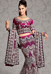 A most radiant carnival of style and beauty. A beautiful A-line lehenga made with net fabric. This lehenga embellished with zardozi, crystal stone, salma, sitara, sequins, cutdana, badla, zari, beads and velvet patch work. The beautiful embroidery on lehenga made it awesome and gives you stylish and attractive look to others. The matching blouse and embroidered dupatta are enhanced your personality. The bust size of choli can be customized upto 42 inches. Lehenga length can be customizing upto 42 inches. Slight Color variations are possible due to differing screen and photograph resolutions.