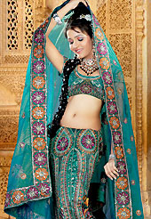 Take a look on the changing fashion of the season. A beautiful lehenga choli nicely designed with resham, zari, sequins, stone worked embroidered velvet patch and fabric lace patch in paisley patterns. This lehenga made with dupion silk fabric. Matching blouse and graceful dupatta is available. Slight Color variations are possible due to differing screen and photograph resolutions.