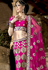 The very silhouette and styling of this outfit proves quiet flattering for most body types and renders a rather grand and majestic appeal. This magenta art silk fish cut lehenga choli is nicely embroidered with resham, stone, lace and patch work done in form of floral motiff. Matching dupion silk blouse with net dupatta available with this. All over embroidery in lehenga is highlighting the beauty of this lehenga. Lehenga waist can be customize upto 42 inches, length 40 inches and the bust size is upto 40 inches. As shown lehenga is available. Accessories shown in the image is just for photography purpose. Slight color variations are possible due to differing screen and photograph resolution.