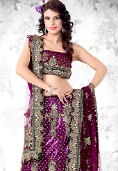 Make your collection more attractive and charming with this impressive dress. This Magenta net lehenga choli is nicely embroidered patch work done with resham, zari, sequins, stone, cutdana and kasab worked rich embroidery on all over lehenga. The beautiful embroidery on lehenga made it awesome and gives you stylish and attractive look to others. Border on dupatta made it stylish and fabulous, gives you a stunning look. Matching choli and dupatta is availble with this lehenga. The choli bust size can be customize upto 38 inches. Slight Color variations are possible due to differing screen and photograph resolutions.