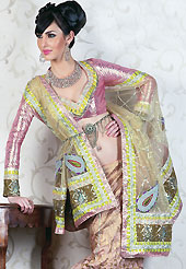 Embroidered lehengas are highly in order on a range of occasions such as wedding, formal party and festivals. This beige and pink A-Line crush art silk lehenga choli is nicely embroidered patch work. Embroidery is done with resham, zari, sequins and gota patti work in form of floral motifs. The beautiful embroidery on lehenga made it awesome and gives you stylish and attractive look to others. Contrasting pink brocade choli and light pastel green net dupatta is available with this lehenga. Accessories shown in the image is just for photography purpose. Slight Color variations are possible due to differing screen and photograph resolutions. 