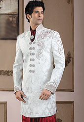 Make your collection more attractive with this dazzling sherwani. This sherwani made with pure banarasi fabric. This sherwani embellished with cutdana, pearls, beads and stones. Embroiderey work on collar, front and cuff made it stylish and fabulous, gives you a stunning look. Slight Color variations possible due to differing screen and photograph resolutions.