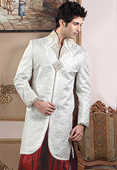 Fantastic sherwani made pure banarasi silk with dhoti. Amazing sherwani adorned with stones, zardosi and sequins. Stylish pazama made it very pretty. Outfit is a novel ways of getting yourself noticed. A heavy embroidery on front border, collar and cuffs are enhanced your personality. Slight Color variations possible due to differing screen and photograph resolutions.