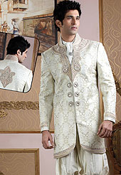 Emblem of fashion and style, each piece of our range of Designer Sherwani is certain to enhance your look as per todays trends baije jari jamewar fabric worked with stones, beads, pearls and cutdana. A contrasting dhoti are enhanced your personality. Outfit is a novel ways of getting yourself noticed. A heavy embroidery on front border, collar and cuffs are enhanced your personality. Slight Color variations possible due to differing screen and photograph resolutions.