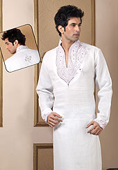 Make your collection more attractive with this dazzling dress. This kurta made with linen fabric. This kurta embellished with cutdana, beads, pearls and stones. The beautiful heavy embroidery on collar, front and cuff made it awesome and gives you stylish and attractive look to others. This kurta paired with same color fabric pathani salwar that completes the look. Slight Color variations possible due to differing screen and photograph resolutions.