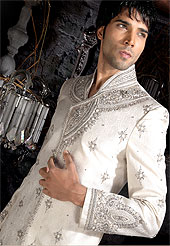 Its cool and have a very modern look to impress all. This sherwani made with brocade silk fabric. This sherwani embellished with stone and  resham work. The beautiful heavy embroidery on collar, front and cuff made it awesome and gives you stylish and attractive look to others. The matching churidar is enhanced your personality. Slight Color variations possible due to differing screen and photograph resolutions.