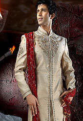 Today  fashion is really about sensuality which can be seen in this creation. Embellish yourself with the classy dress.  This sherwani made with Banarasi antique.  This sherwani embellished with stone,cutdana and zardosi work. The beautiful heavy embroidery on collar made it awesome and gives you stylish and attractive look to others. The contarsting churidar is enhanced your personality. Slight Color variations possible due to differing screen and photograph resolutions.            