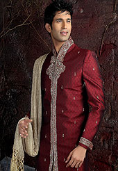 Its cool and have a very modern look to impress all. This sherwani made with pure silk fabric. This sherwani embellished with zardosi, beads, and stone work. The beautiful heavy embroidery on collar, front, back and cuff made it awesome and gives you stylish and attractive look to others. The matching readymade  dhoti with heavy look gives you traditional look. Slight Color variations possible due to differing screen and photograph resolutions.