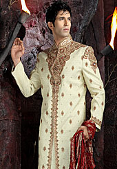 Today  fashion is really about sensuality which can be seen in this creation. Embellish yourself with the classy dress.  This sherwani made with tanchoi jamewar.  This sherwani embellished with stone, beads and resham work. The beautiful heavy embroidery on collar made it awesome and gives you stylish and attractive look to others. The contarsting churidar is enhanced your personality. Slight Color variations possible due to differing screen and photograph resolutions.            