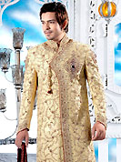 Its cool and have a very modern look to impress all. This cream maharaja angrakha style sherwani embellished with swarowski, stones, heavy zardosi, cutdana and patch work. The beautiful heavy embroidery on front border, collar, back and cuffs made it awesome and gives you stylish and attractive look to others. Contrasting churidar is enhanced your personality. This sherwani made with cotton silk fabric. Accessories shown in the image is just for photography purpose. Slight Color variations are possible due to differing screen and photograph resolutions.