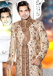 Today fashion is really about sensuality which can be seen in this creation. This light fawn sherwani embellished with stones, heavy zardosi, cutdana and patch work. The beautiful heavy embroidery on front border, collar and cuffs made it awesome and gives you stylish and attractive look to others. Contrasting churidar is enhanced your personality. This sherwani made with brocade fabric. Accessories shown in the image is just for photography purpose. Slight Color variations are possible due to differing screen and photograph resolutions.