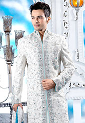 Make your collection more attractive with this dazzling dress. This off white sherwani embellished with zari, sequins, beads, stone and patch work. The beautiful heavy embroidery on front border, collar, back and cuffs made it awesome and gives you stylish and attractive look to others. Contrasting churidar is enhanced your personality. This sherwani made with cotton silk fabric. Accessories shown in the image is just for photography purpose. Slight Color variations are possible due to differing screen and photograph resolutions.