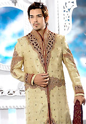 Today fashion is really about sensuality which can be seen in this creation. This beige sherwani embellished with all over cut work with velvet patch, resham, cutdana and stone work. The beautiful heavy embroidery on front border, collar, back and cuffs made it awesome and gives you stylish and attractive look to others. Contrasting churidar is enhanced your personality. This sherwani made with cotton silk fabric. Accessories shown in the image is just for photography purpose. Slight Color variations are possible due to differing screen and photograph resolutions.