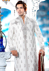Its cool and have a very modern look to impress all. This off white sherwani embellished with all over self silver stone with resham, cutdana, beads and stone work. The beautiful heavy embroidery on front border, collar, back and cuffs made it awesome and gives you stylish and attractive look to others. Contrasting churidar is enhanced your personality. This sherwani made with jacquard fabric. Accessories shown in the image is just for photography purpose. Slight Color variations are possible due to differing screen and photograph resolutions.