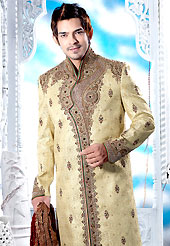 Emblem of fashion and style, each piece of our range of designer sherwani is certain to enhance your look as per todays trends. This cream sherwani embellished with resham, zari, sequins, beads, cutdana, stone and patch work. The beautiful heavy embroidery on front border, collar, back and cuffs made it awesome and gives you stylish and attractive look to others. Contrasting churidar is enhanced your personality. This sherwani made with cotton silk fabric. Accessories shown in the image is just for photography purpose. Slight Color variations are possible due to differing screen and photograph resolutions.