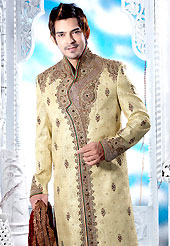 Emblem of fashion and style, each piece of our range of designer sherwani is certain to enhance your look as per todays trends. This cream sherwani embellished with resham, zari, sequins, beads, cutdana, stone and patch work. The beautiful heavy embroidery on front border, collar, back and cuffs made it awesome and gives you stylish and attractive look to others. Contrasting churidar is enhanced your personality. This sherwani made with cotton silk fabric. Accessories shown in the image is just for photography purpose. Slight Color variations are possible due to differing screen and photograph resolutions.