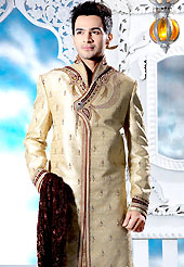 Today fashion is really about sensuality which can be seen in this creation. This beige sherwani embellished with zari, sequins, beads, cutdana, zarkan, stone and patch work. The beautiful heavy embroidery on front border, collar, back and cuffs made it awesome and gives you stylish and attractive look to others. Contrasting churidar is enhanced your personality. This sherwani made with jacquard fabric. Accessories shown in the image is just for photography purpose. Slight Color variations are possible due to differing screen and photograph resolutions.