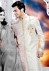 Emblem of fashion and style, each piece of our range of designer sherwani is certain to enhance your look as per todays trends. This off white sherwani embellished with zari, sequins, beads, stone and patch work. The beautiful heavy embroidery on front border, collar, back and cuffs made it awesome and gives you stylish and attractive look to others. Matching churidar is enhanced your personality. This sherwani made with jacquard fabric. Accessories shown in the image is just for photography purpose. Slight Color variations are possible due to differing screen and photograph resolutions.