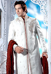 Make your collection more attractive with this dazzling sherwani. This off white sherwani embellished with sequins, beads, stone, zarkan, zardosi and patch work. The beautiful heavy embroidery on front border, collar, back and cuffs made it awesome and gives you stylish and attractive look to others. Contrasting churidar is enhanced your personality. This sherwani made with jacquard fabric. Accessories shown in the image is just for photography purpose. Slight Color variations are possible due to differing screen and photograph resolutions.