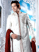 Make your collection more attractive with this dazzling sherwani. This off white sherwani embellished with sequins, beads, stone, zarkan, zardosi and patch work. The beautiful heavy embroidery on front border, collar, back and cuffs made it awesome and gives you stylish and attractive look to others. Contrasting churidar is enhanced your personality. This sherwani made with jacquard fabric. Accessories shown in the image is just for photography purpose. Slight Color variations are possible due to differing screen and photograph resolutions.
