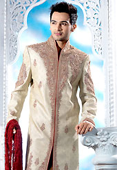 Emblem of fashion and style, each piece of our range of designer sherwani is certain to enhance your look as per todays trends. This cream sherwani embellished with zari, sequins, beads, stone and patch work. The beautiful heavy embroidery on front border, collar, back and cuffs made it awesome and gives you stylish and attractive look to others. Contrasting churidar is enhanced your personality. This sherwani made with jacquard fabric. Accessories shown in the image is just for photography purpose. Slight Color variations are possible due to differing screen and photograph resolutions.