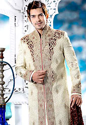 Its cool and have a very modern look to impress all. This cream royal look sherwani embellished with cut work, maroon velvet Patch, beads, sequins, all over heavy zarkan and stone work. The beautiful heavy embroidery on front border, collar, back and cuffs made it awesome and gives you stylish and attractive look to others. Contrasting churidar is enhanced your personality. This sherwani made with jacquard fabric. Accessories shown in the image is just for photography purpose. Slight Color variations are possible due to differing screen and photograph resolutions.