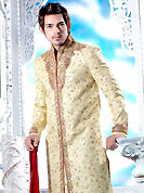 Today fashion is really about sensuality which can be seen in this creation. This cream sherwani designed with all over resham, beads, sequins, stone and patch work. The beautiful embroidery on front border, collar, back and cuffs made it awesome and gives you stylish and attractive look to others. Contrasting churidar is enhanced your personality. This sherwani made with cotton silk fabric. Accessories shown in the image is just for photography purpose. Slight Color variations are possible due to differing screen and photograph resolutions.