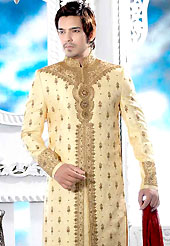 Make your collection more attractive with this dazzling dress. This cream elegant sherwani designed with all over resham, cutdana, beads, stone and patch work. The beautiful heavy embroidery on front border, collar, back and cuffs made it awesome and gives you stylish and attractive look to others. Contrasting churidar is enhanced your personality. This sherwani made with jacquard fabric. Accessories shown in the image is just for photography purpose. Slight Color variations are possible due to differing screen and photograph resolutions.