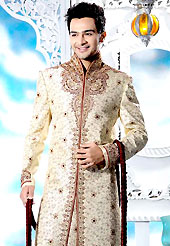 Its cool and have a very modern look to impress all. This cream sherwani designed with all over resham, beads, sequins, stone and patch work. The beautiful embroidery on front border, collar, back and cuffs made it awesome and gives you stylish and attractive look to others. Contrasting churidar is enhanced your personality. This sherwani made with cotton silk fabric. Accessories shown in the image is just for photography purpose. Slight Color variations are possible due to differing screen and photograph resolutions.
