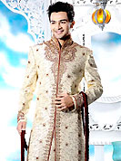 Its cool and have a very modern look to impress all. This cream sherwani designed with all over resham, beads, sequins, stone and patch work. The beautiful embroidery on front border, collar, back and cuffs made it awesome and gives you stylish and attractive look to others. Contrasting churidar is enhanced your personality. This sherwani made with cotton silk fabric. Accessories shown in the image is just for photography purpose. Slight Color variations are possible due to differing screen and photograph resolutions.