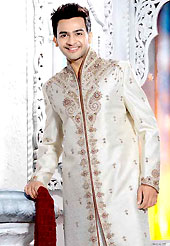 Make your collection more attractive with this dazzling dress. This off white elegant sherwani designed with all over stone, cutdana, beads, zarkan, broches, stone and patch work. The beautiful embroidery on front border, collar, back and cuffs made it awesome and gives you stylish and attractive look to others. Contrasting churidar is enhanced your personality. This sherwani made with brocade fabric. Accessories shown in the image is just for photography purpose. Slight Color variations are possible due to differing screen and photograph resolutions.