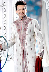 Make your collection more attractive with this dazzling sherwani. This off white elegant sherwani designed with resham, sequins, cutdana, beads, zarkan, stone and patch work. The beautiful embroidery on front border, collar, back and cuffs made it awesome and gives you stylish and attractive look to others. Contrasting churidar is enhanced your personality. This sherwani made with brocade fabric. Accessories shown in the image is just for photography purpose. Slight Color variations are possible due to differing screen and photograph resolutions.