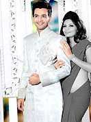 Make your collection more attractive with this dazzling sherwani. This off white elegant sherwani designed with cutdana, zardosi, stone, heavy zarkan and patch work. The beautiful embroidery collar, back and cuffs made it awesome and gives you stylish and attractive look to others. Matching churidar is enhanced your personality. This sherwani made with jacquard fabric. Accessories shown in the image is just for photography purpose. Slight Color variations are possible due to differing screen and photograph resolutions.