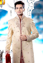 Its cool and have a very modern look to impress all. This cream elegant sherwani designed with all over beads, zardosi, stone and patch work. The beautiful heavy embroidery on front border, collar, back and cuffs made it awesome and gives you stylish and attractive look to others. Contrasting dhoti is enhanced your personality. This sherwani made with jacquard fabric. Accessories shown in the image is just for photography purpose. Slight Color variations are possible due to differing screen and photograph resolutions.
