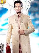 Its cool and have a very modern look to impress all. This cream elegant sherwani designed with all over beads, zardosi, stone and patch work. The beautiful heavy embroidery on front border, collar, back and cuffs made it awesome and gives you stylish and attractive look to others. Contrasting dhoti is enhanced your personality. This sherwani made with jacquard fabric. Accessories shown in the image is just for photography purpose. Slight Color variations are possible due to differing screen and photograph resolutions.