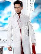 Emblem of fashion and style, each piece of our range of designer sherwani is certain to enhance your look as per todays trends. This off white elegant sherwani designed with all over beads, zarkan, zardosi, stone and patch work. The beautiful heavy embroidery on front border, collar, back and cuffs made it awesome and gives you stylish and attractive look to others. Contrasting dhoti is enhanced your personality. This sherwani made with jacquard fabric. Accessories shown in the image is just for photography purpose. Slight Color variations are possible due to differing screen and photograph resolutions.