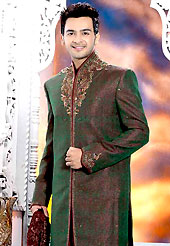 Its cool and have a very modern look to impress all. This deep green elegant sherwani designed with all over beads, zarkan, zardosi, stone and patch work. The beautiful heavy embroidery on front border, collar, back and cuffs made it awesome and gives you stylish and attractive look to others. Contrasting dhoti is enhanced your personality. This sherwani made with jacquard fabric. Accessories shown in the image is just for photography purpose. Slight Color variations are possible due to differing screen and photograph resolutions.