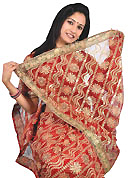 Ultimate collection of embroidered sarees with fabulous style. This red saree is beautifully designed with extensive embroidery and patch work. Embroidery is done with zari, sequins and stone work in form of floral motifs. This fabulous party wear saree is specially crafted for your stunning and gorgeous look. This beautiful drape is crafted with net fabric. Matching blouse come along with this saree. Slight color variations are possible due to differing screen and photograph resolution.