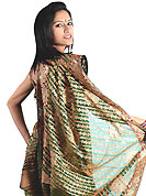 Be the cynosure of all eyes with this wonderful casual wear in flattering colors and combinations. This green saree is beautifully designed with extensive embroidery and patch work. Embroidery is done with zari, sequins and stone work in form of floral motifs. This beautiful drape is crafted with net fabric. Matching blouse come along with this saree. Slight color variations are possible due to differing screen and photograph resolution.