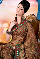 You can be sure that ethnic fashions selections of clothing are taken from the latest trend in today’s fashion. This brown saree is nicely designed with embroidered patch. Embroidery is done with resham, zari and stone work in form of floral motifs. This saree gives you a modern and different look in fabulous style. This beautiful drape is crafted with glass tissue fabric. Matching blouse is available with this saree. Slight color variations are possible due to differing screen and photograph resolution.